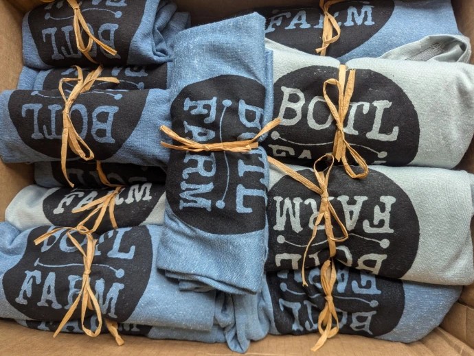 pile of branded shirts, very good-looking