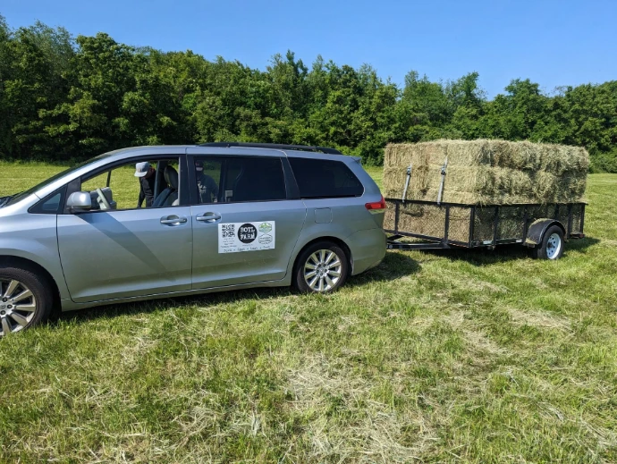 Farm "truck" with hay wagon in a field