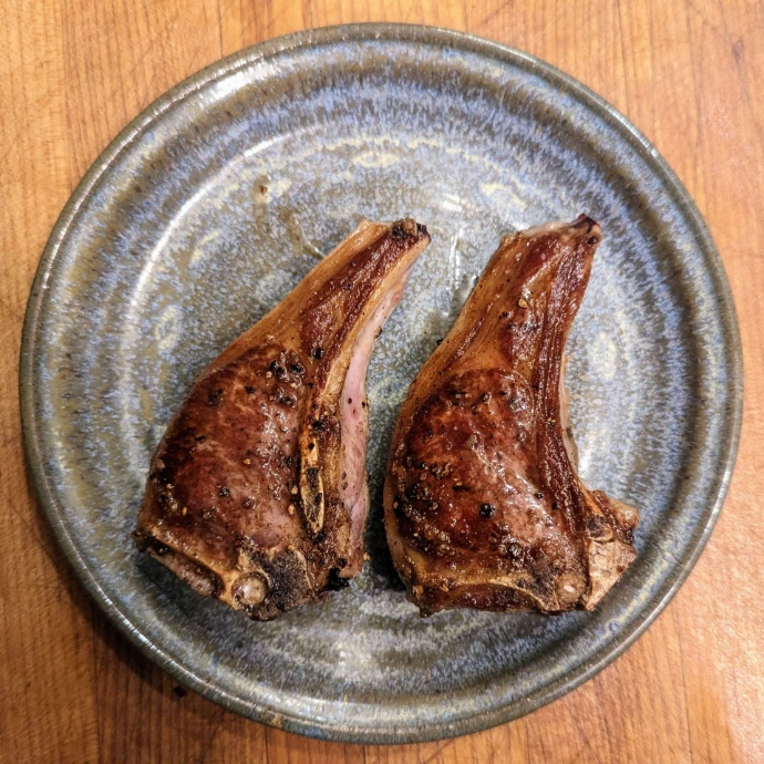 Lamb chops on a pottery plate
